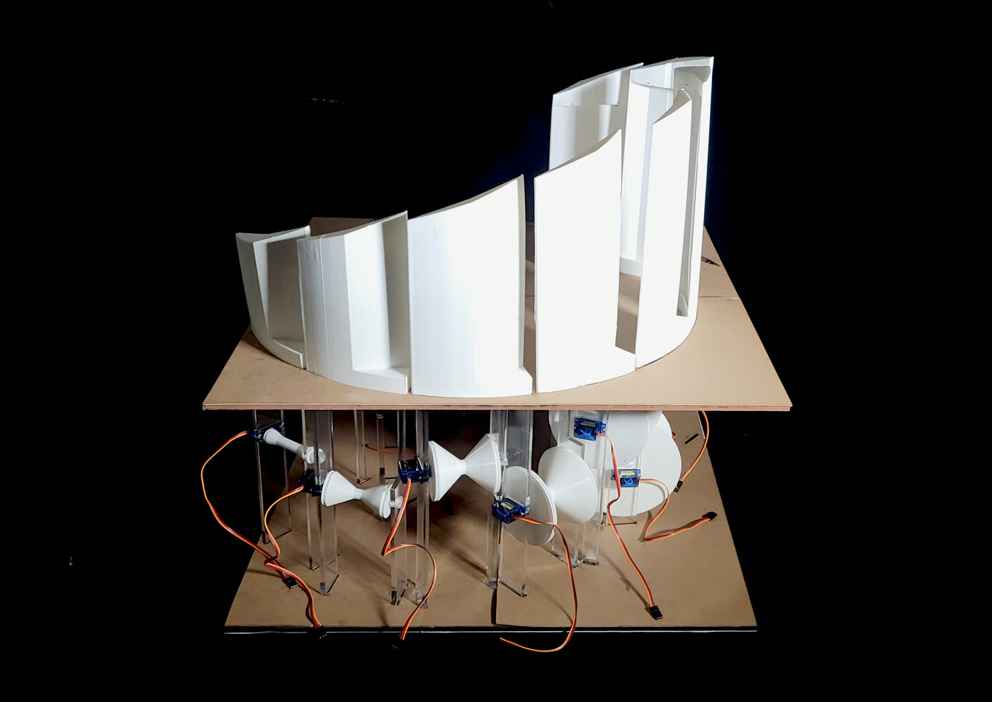 Physical model mock-up with servos and wiring visible underneath